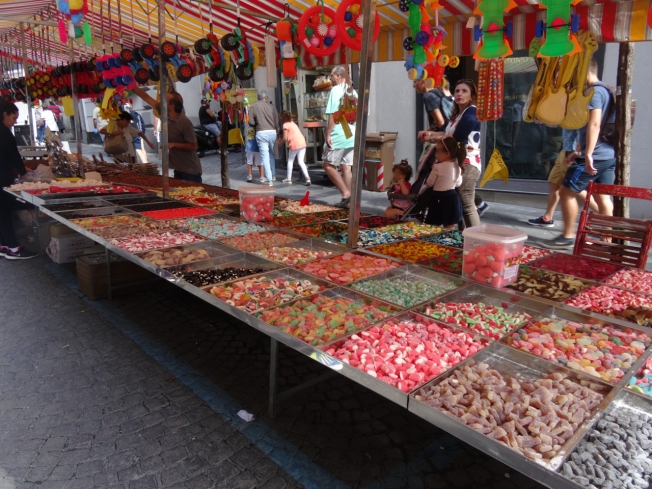 Sweet stalls in Via Duomo in Naples, Italy